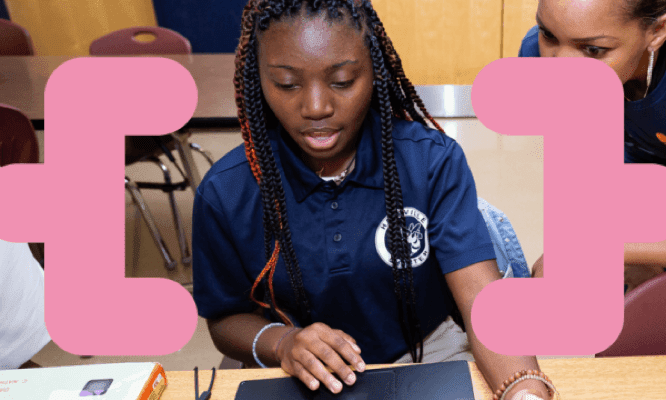 A high school student working on a computer